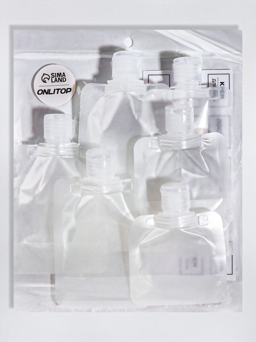 Компактный набор органайзеров для хранения жидкостей и косметики Набор из 6 прозрачных контейнеров с белыми крышками для удобного хранения жидкости и косметики