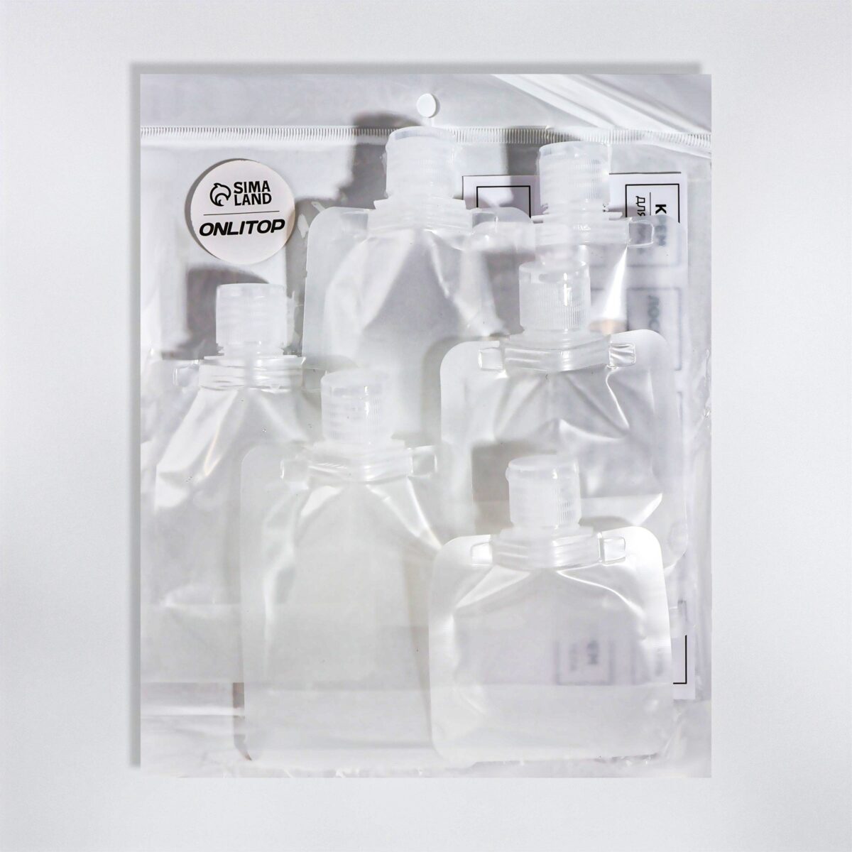 Набор контейнеров для хранения жидкостей с прозрачным зип-пакетом Прозрачные пластиковые контейнеры для хранения жидкостей упакованные в удобный зип-пакет