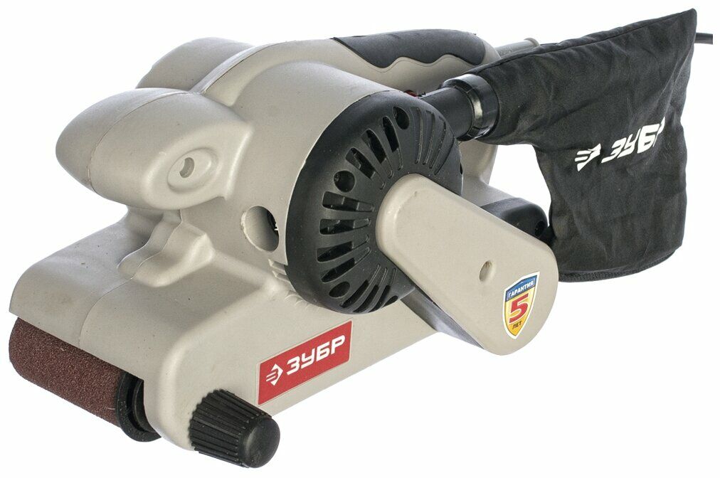 Ленточная шлифовальная машина ЗУБР со светло-серым корпусом, красными и черными элементами, комплектом пылесборника и гарантией 5 лет