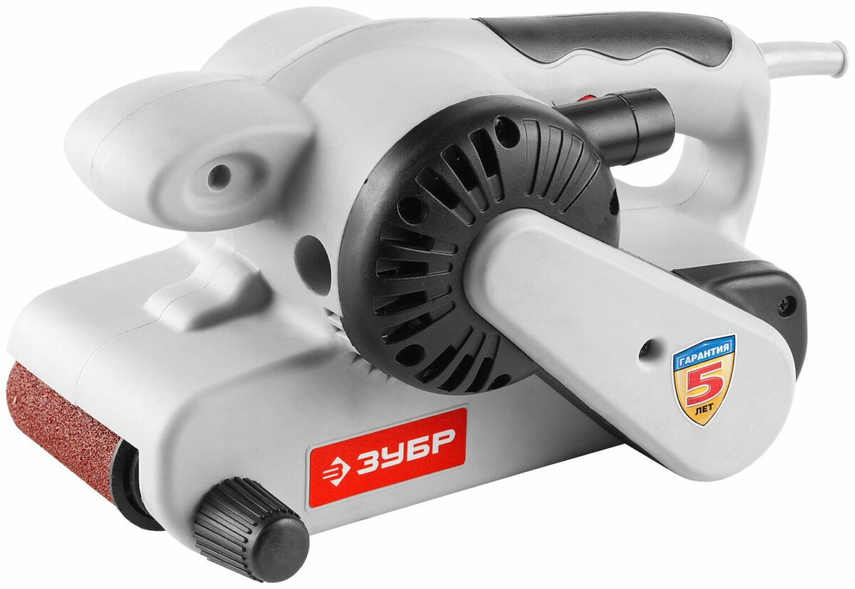 Ленточная шлифовальная машина бренда Зубр с серым корпусом, черными и красными элементами, абразивной лентой и удобной рукояткой
