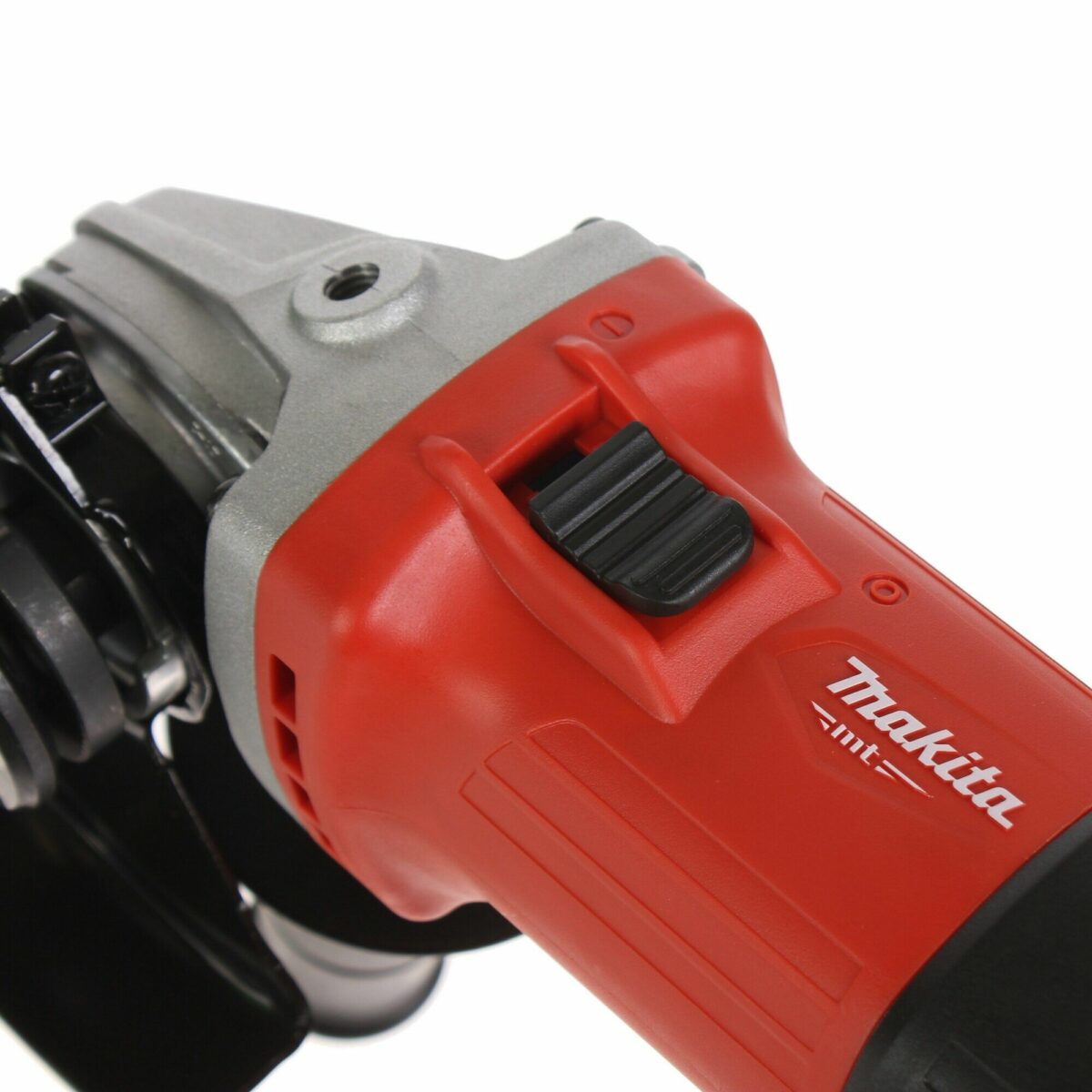 Красная угловая шлифовальная машина бренда Makita MT с черной кнопкой включения и серебристым редуктором